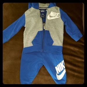 Nike 2 piece,hooded zipper sweater and pants.